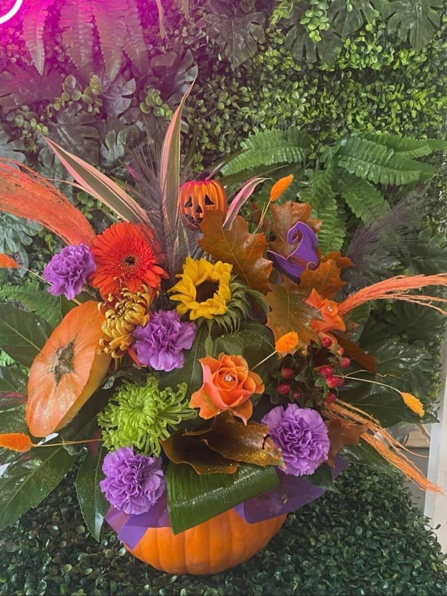 Autumn arrangement in oranges and purples